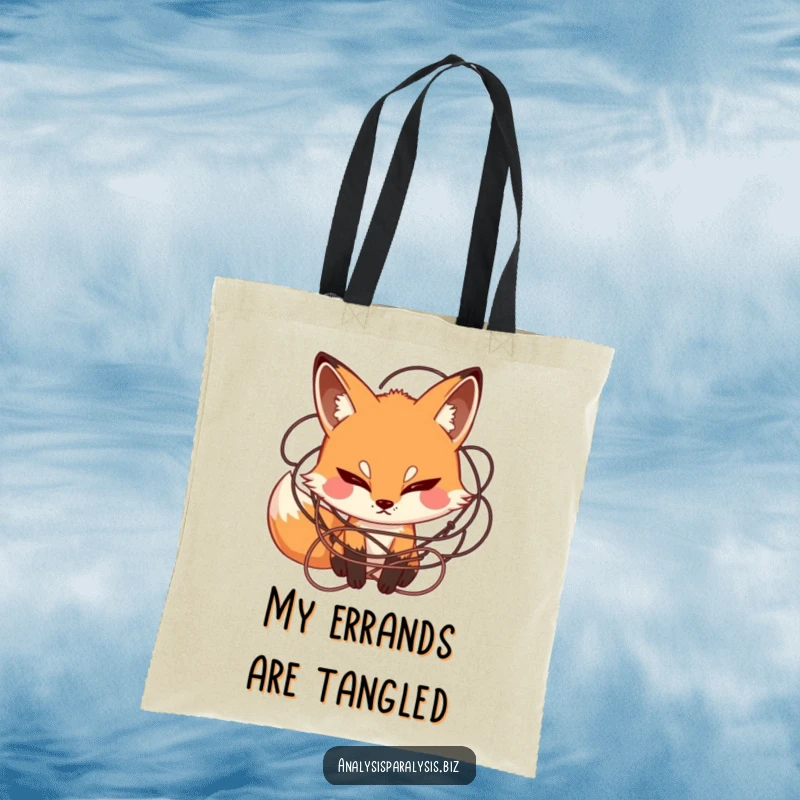 Funny tote bag depicting a curious fox with a furrowed brow, surrounded by a confusing tangle of string, great for everyday use.